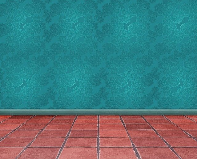 Empty room with stoned floor and skirting board